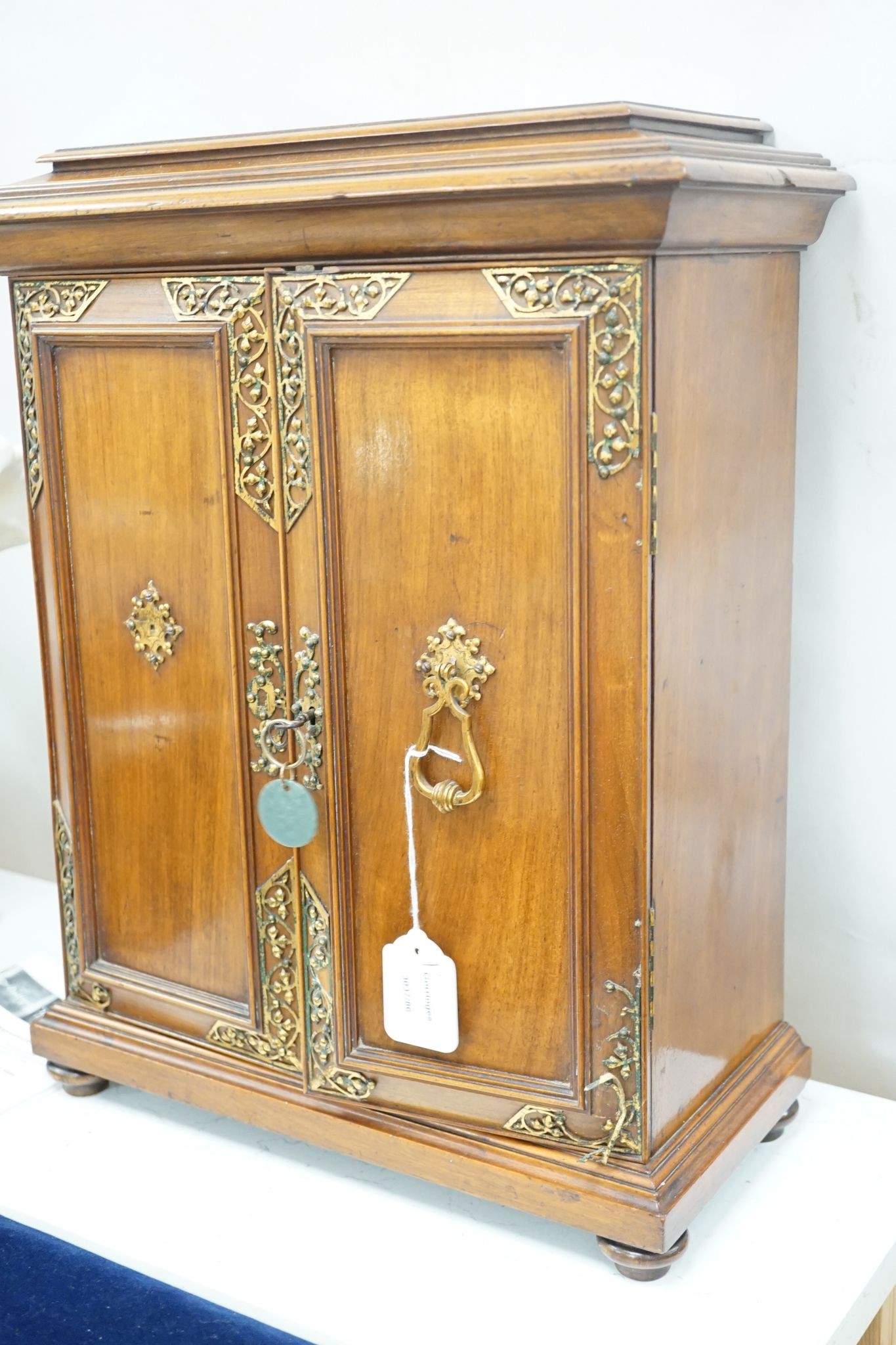 A late 19th century gilt metal mounted walnut games cabinet, W.40cm D.19cm H.49cm